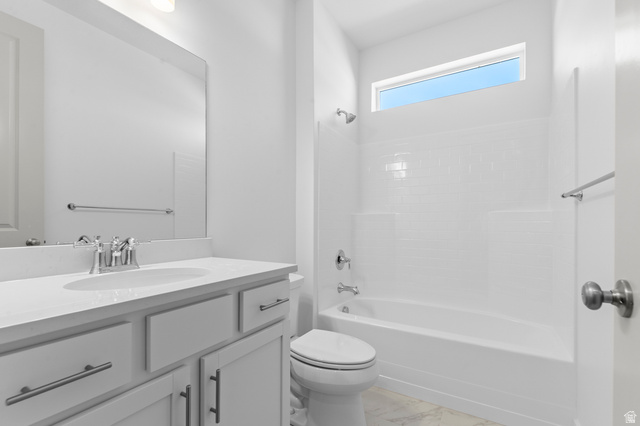 5644 Ibis Road Tooele, UT 84074 - Photo 9 of 19 Modern bathroom featuring a white vanity with an undermount sink, chrome faucet, and ample counter space