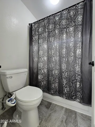 a bathroom with a vanity a sink a mirror and a bathtub