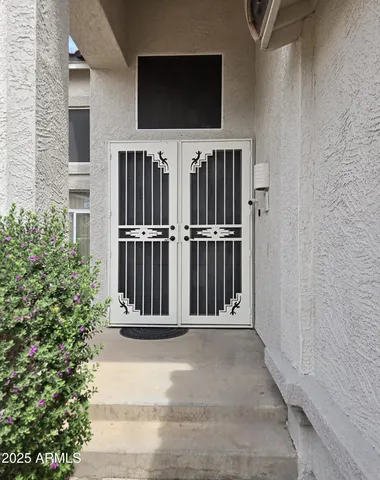 a view of a room with wooden floor and window