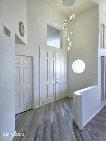 a view of a living room hardwood and kitchen