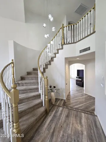 a view of a livingroom with a fireplace and a window
