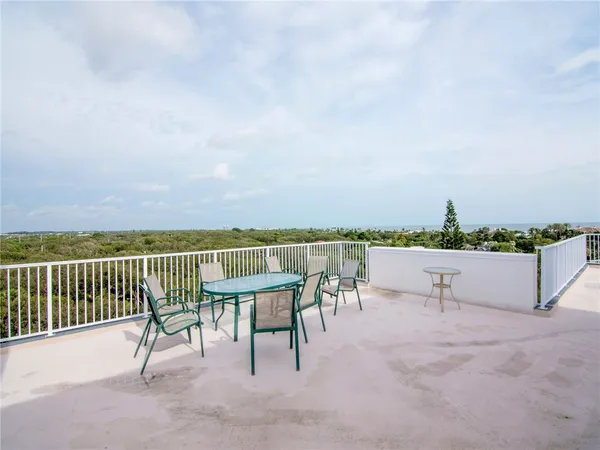 a view of a terrace with sitting area