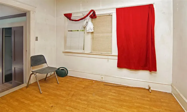 a view of a room with furniture and a window