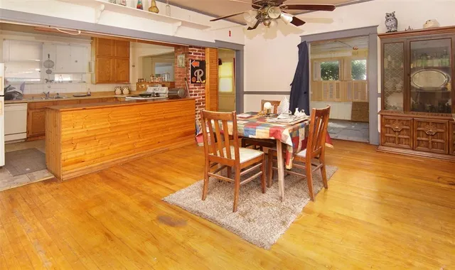 a view of a dining room with furniture and a large window