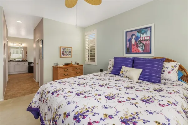 a bedroom with a large bed and a cabinets