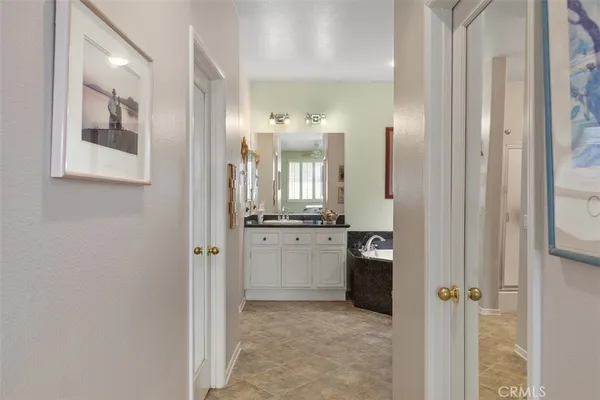 a bathroom with a double vanity sink and mirror
