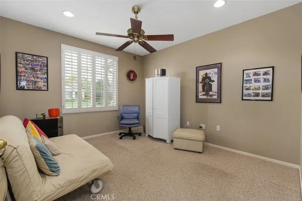 a living room with furniture window and a couch