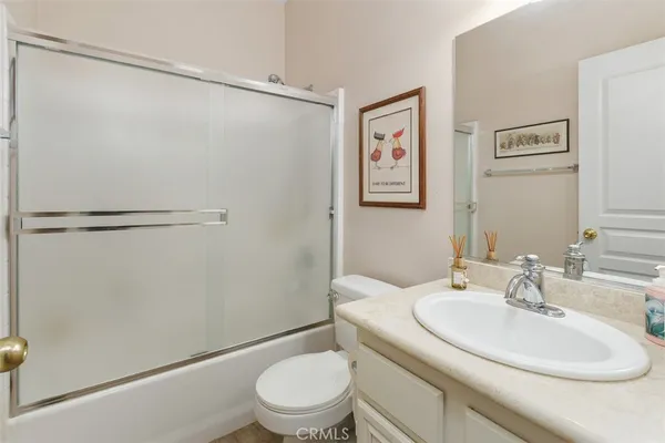 a bathroom with a sink toilet and vanity
