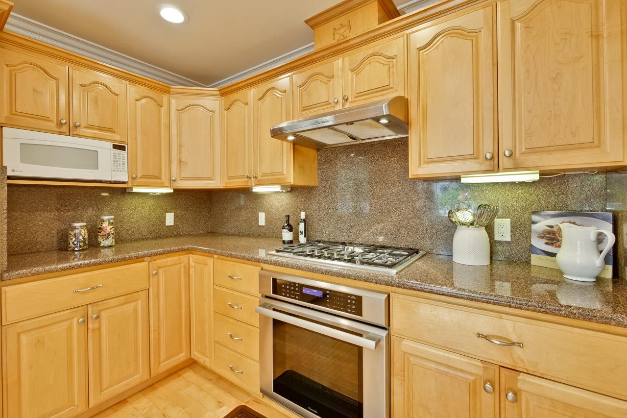 7583 Dumas Drive Cupertino, CA 95014 - Photo 15 of 81 a kitchen with stainless steel appliances granite countertop a sink a stove and cabinets