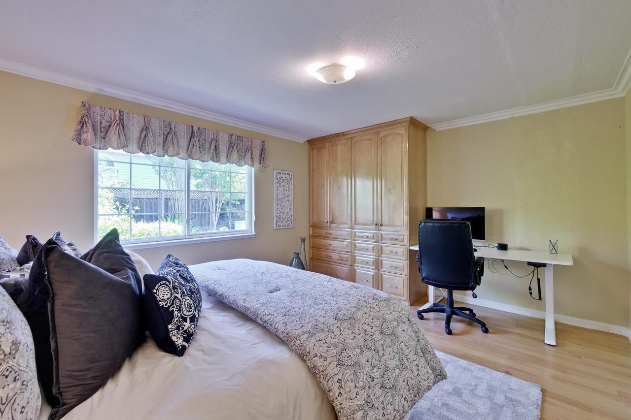7583 Dumas Drive Cupertino, CA 95014 - Photo 28 of 81 a bed room with a bed and a chair