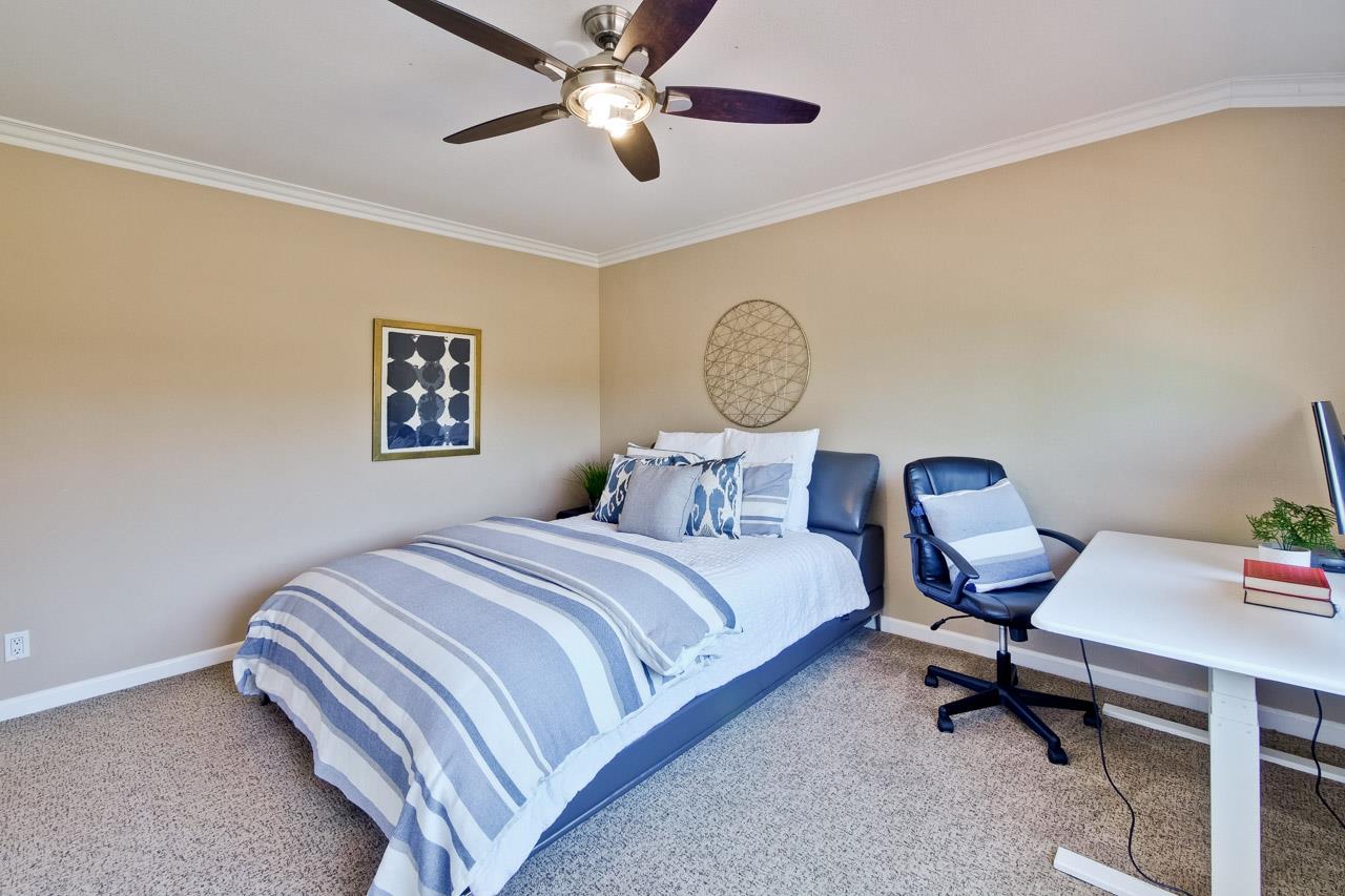 7583 Dumas Drive Cupertino, CA 95014 - Photo 37 of 81 a bedroom with a bed and a chandelier