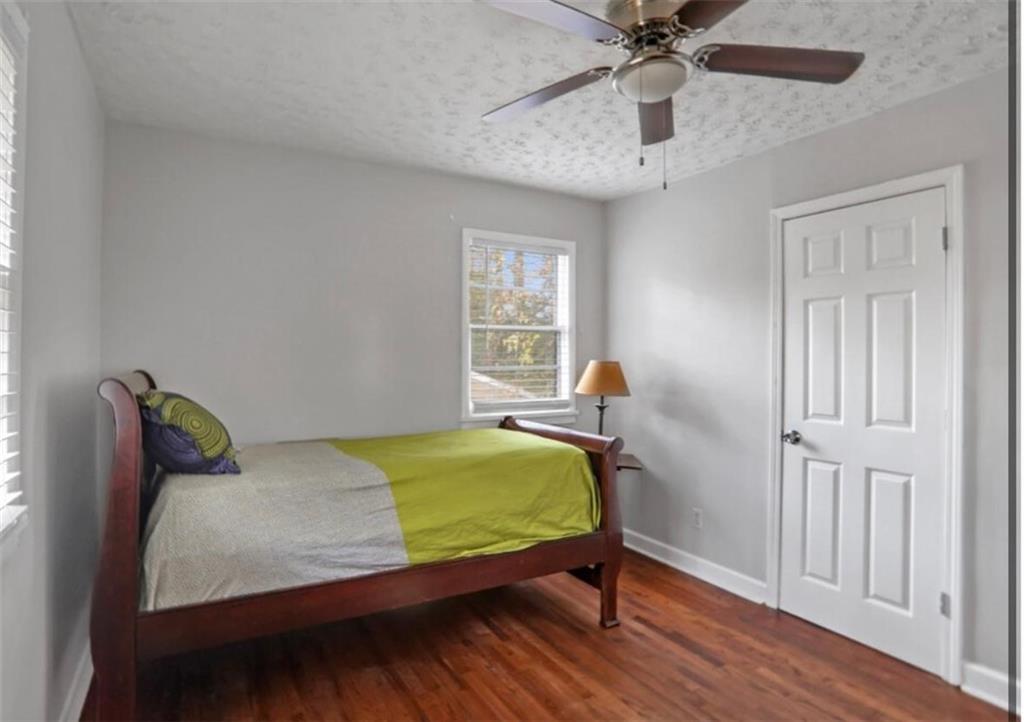 437 Fairlock Lane Northwest Atlanta, GA 30331 - Photo 12 of 26 a bedroom with a bed and window