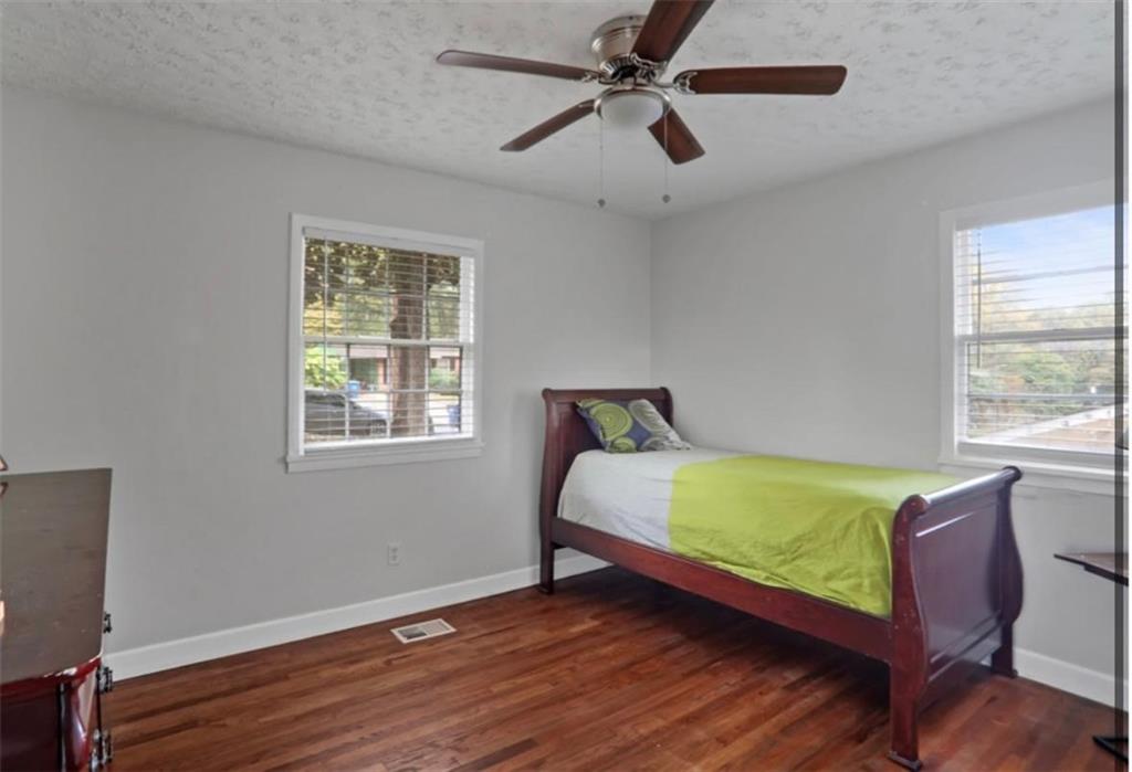 437 Fairlock Lane Northwest Atlanta, GA 30331 - Photo 19 of 26 a room with a bed mirror and window