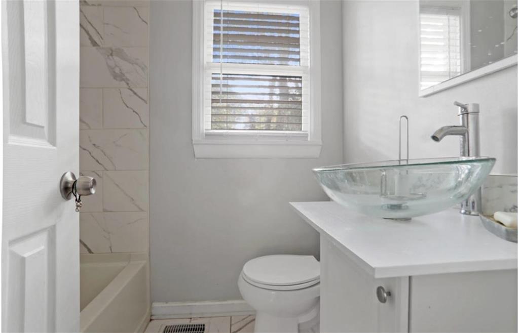437 Fairlock Lane Northwest Atlanta, GA 30331 - Photo 21 of 26 a bathroom with a sink toilet and shower
