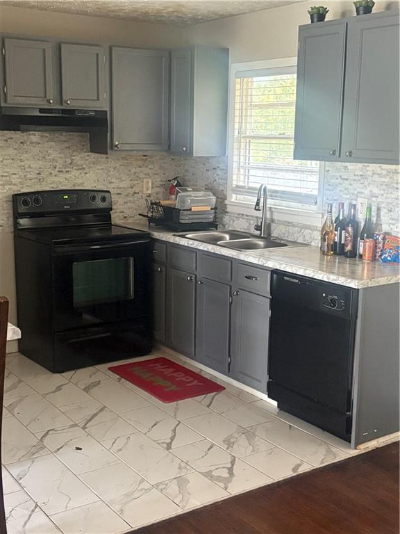 437 Fairlock Lane Northwest Atlanta, GA 30331 - Photo 5 of 26 a kitchen with a sink stove and cabinets