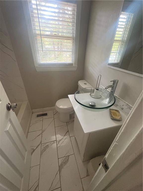 437 Fairlock Lane Northwest Atlanta, GA 30331 - Photo 8 of 26 a bathroom with a sink and a vanity