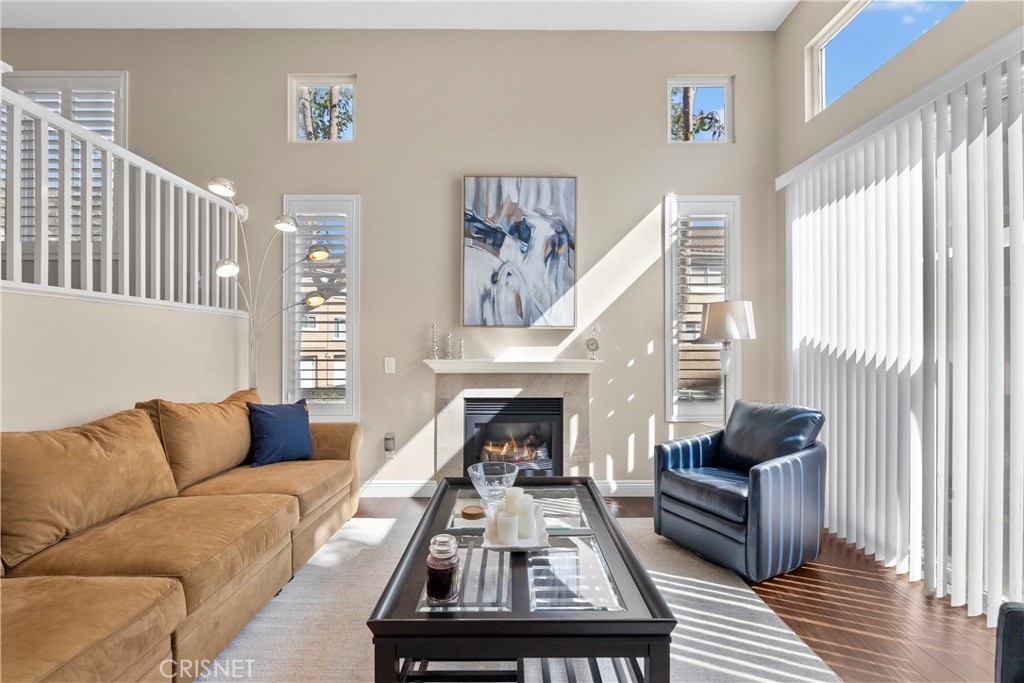 25710 Wagner Way, Unit D Stevenson Ranch, CA 91381 - Photo 1 of 1 a living room with furniture and a fireplace