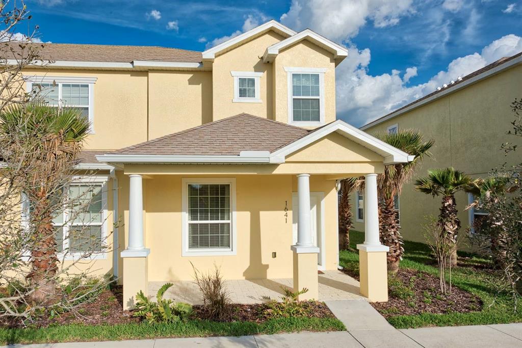 1641 Retreat Circle Clermont, FL 34714 - Photo 1 of 1 a front view of a house with garden