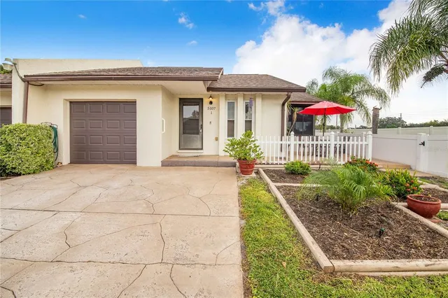 a front view of house with yard and outdoor seating