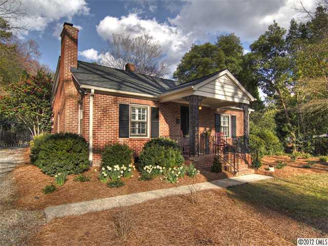 2909 Clover Road Charlotte, NC 28211 - Photo 1 of 16 a front view of a house with garden