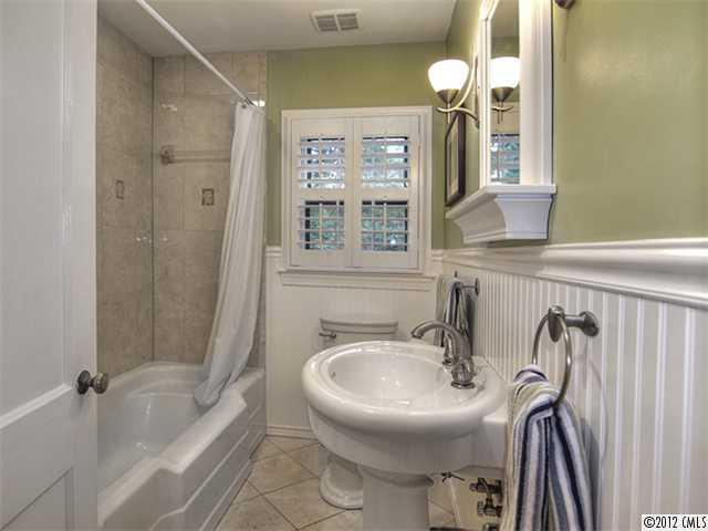 2909 Clover Road Charlotte, NC 28211 - Photo 13 of 16 a bathroom with a sink a toilet and shower