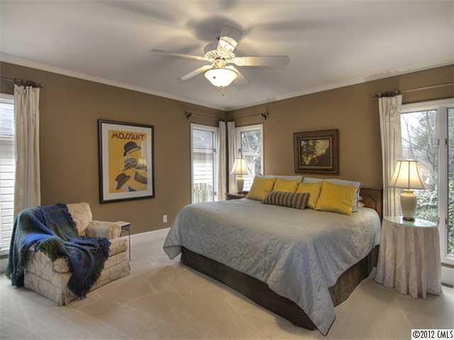 2909 Clover Road Charlotte, NC 28211 - Photo 8 of 16 a bedroom with a bed couch and window