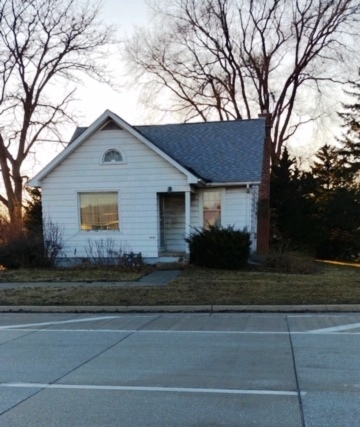 1900 South Roselle Road Roselle, IL 60172 - Photo 1 of 9 a front view of a house with a yard