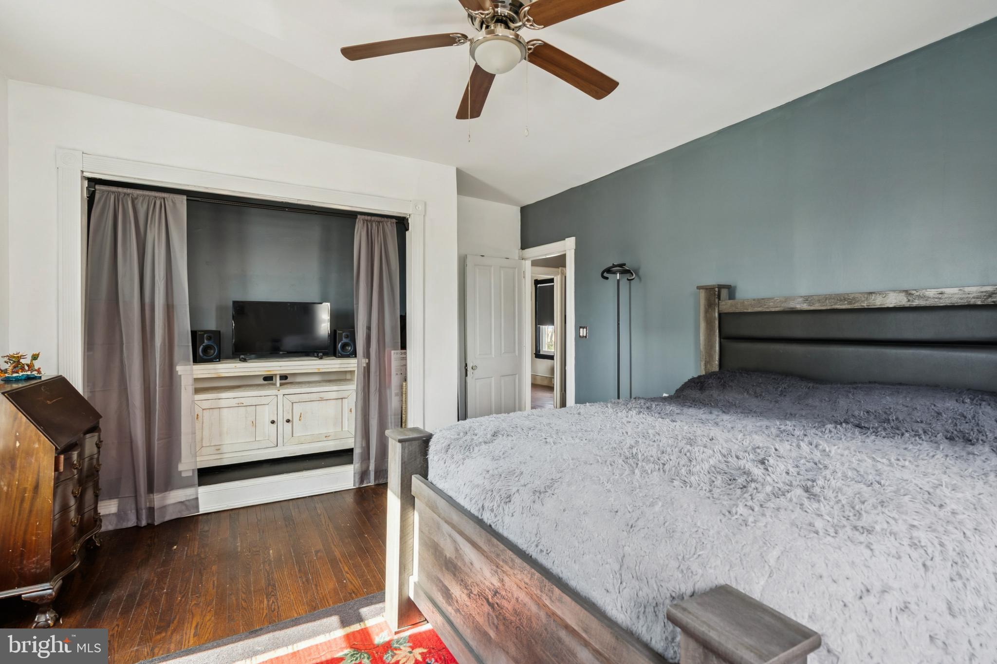 619 Morgan Avenue Palmyra, NJ 08065 - Photo 17 of 27 a bedroom with a bed and a flat screen tv