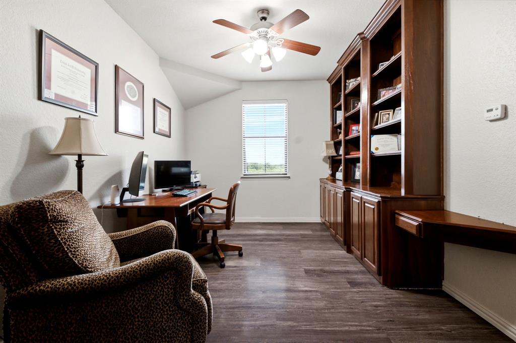 600 Aspen Street Pilot Point, TX 76258 - Photo 23 of 39 Dedicated space featuring extensive built-in wooden shelving and cabinetry