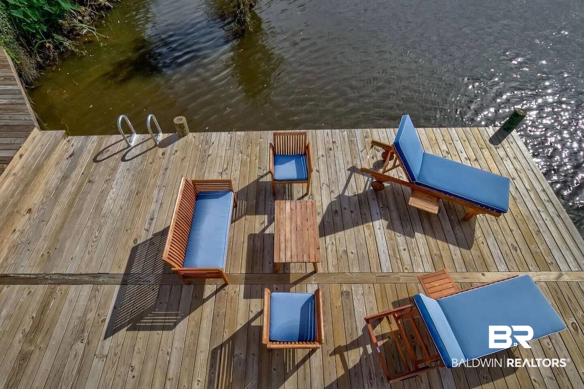 16297 Honey Road Summerdale, AL 36580 - Photo 24 of 24 Expansive wood-finish dock featuring a water access ladder