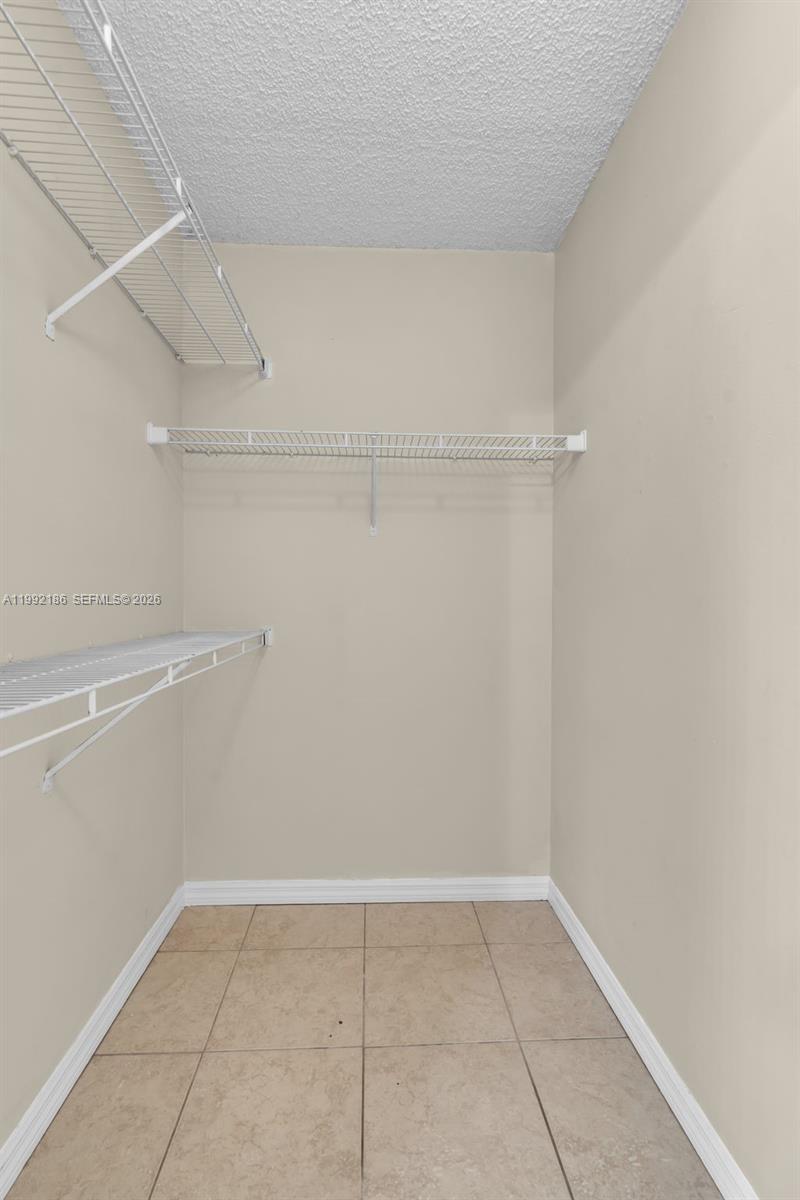 4035 West McNab Road, Unit F101 Pompano Beach, FL 33069 - Photo 12 of 25 a view of an empty walk in closet
