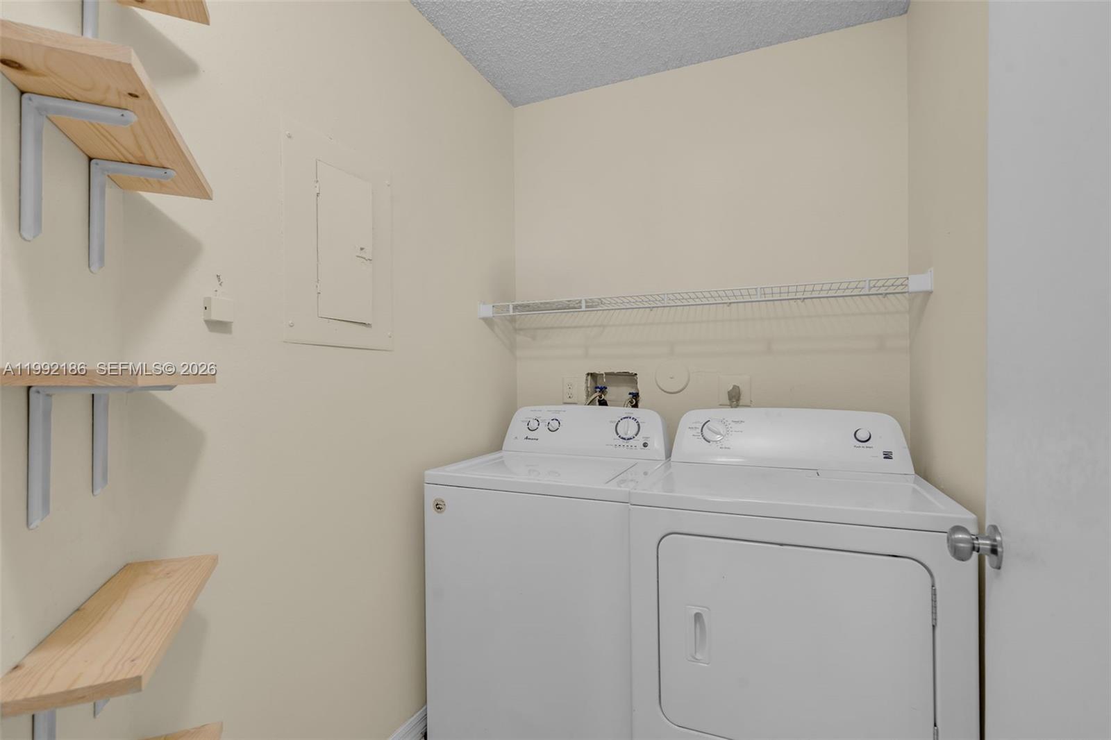 4035 West McNab Road, Unit F101 Pompano Beach, FL 33069 - Photo 21 of 25 a utility room with dryer and washer
