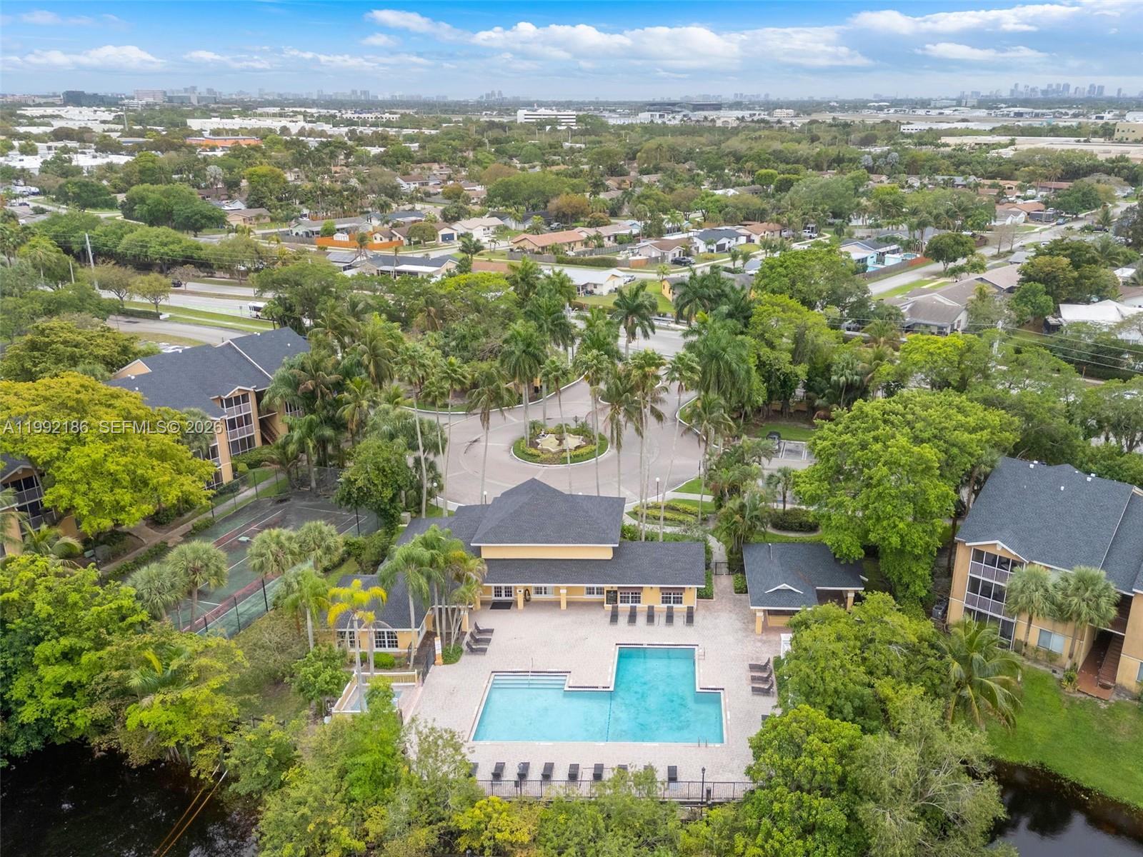 4035 West McNab Road, Unit F101 Pompano Beach, FL 33069 - Photo 24 of 25 an aerial view of residential houses with outdoor space and trees