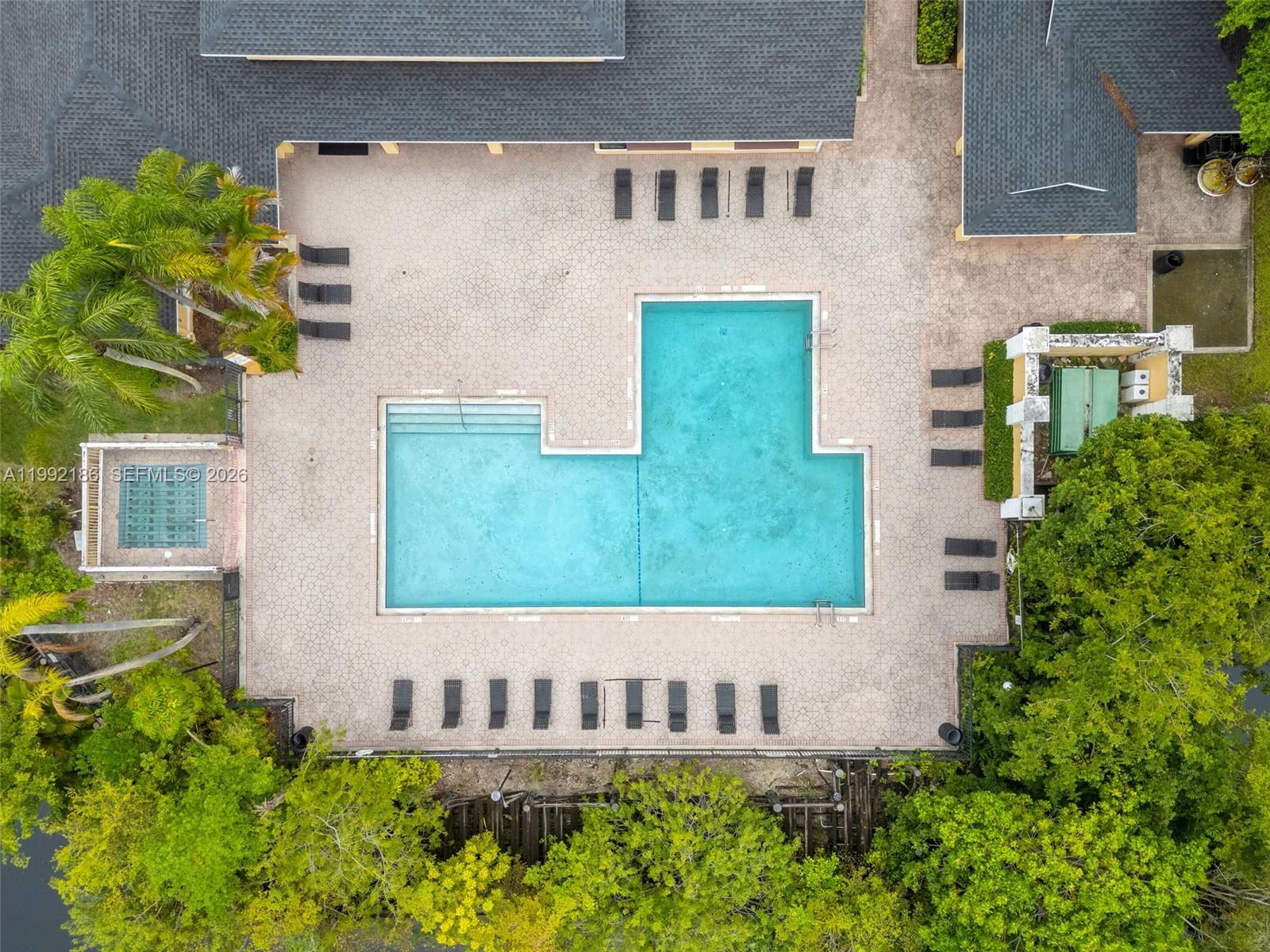 4035 West McNab Road, Unit F101 Pompano Beach, FL 33069 - Photo 25 of 25 front view of a house with a yard