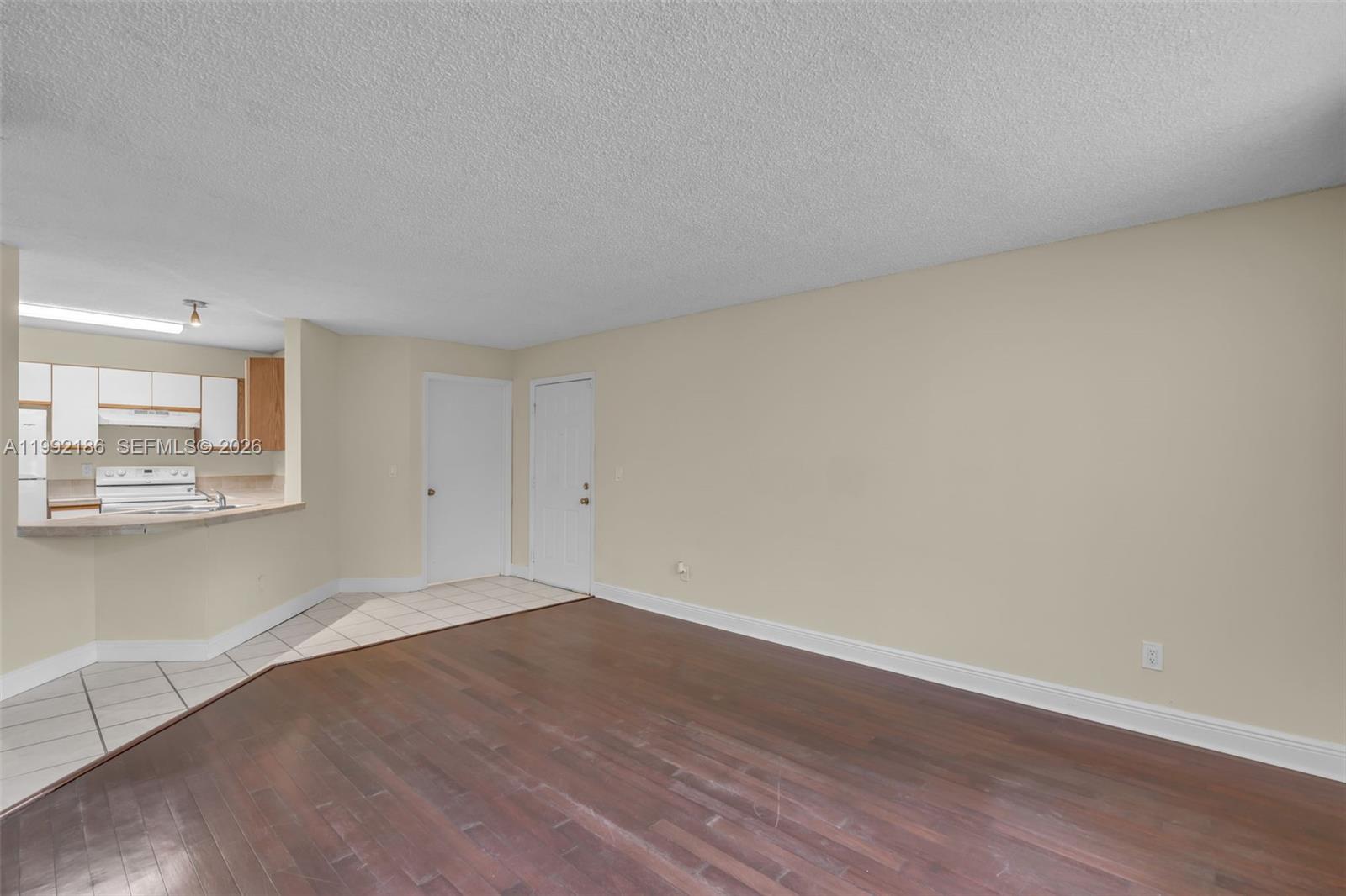 4035 West McNab Road, Unit F101 Pompano Beach, FL 33069 - Photo 5 of 25 a view of a room with wooden floor and a window