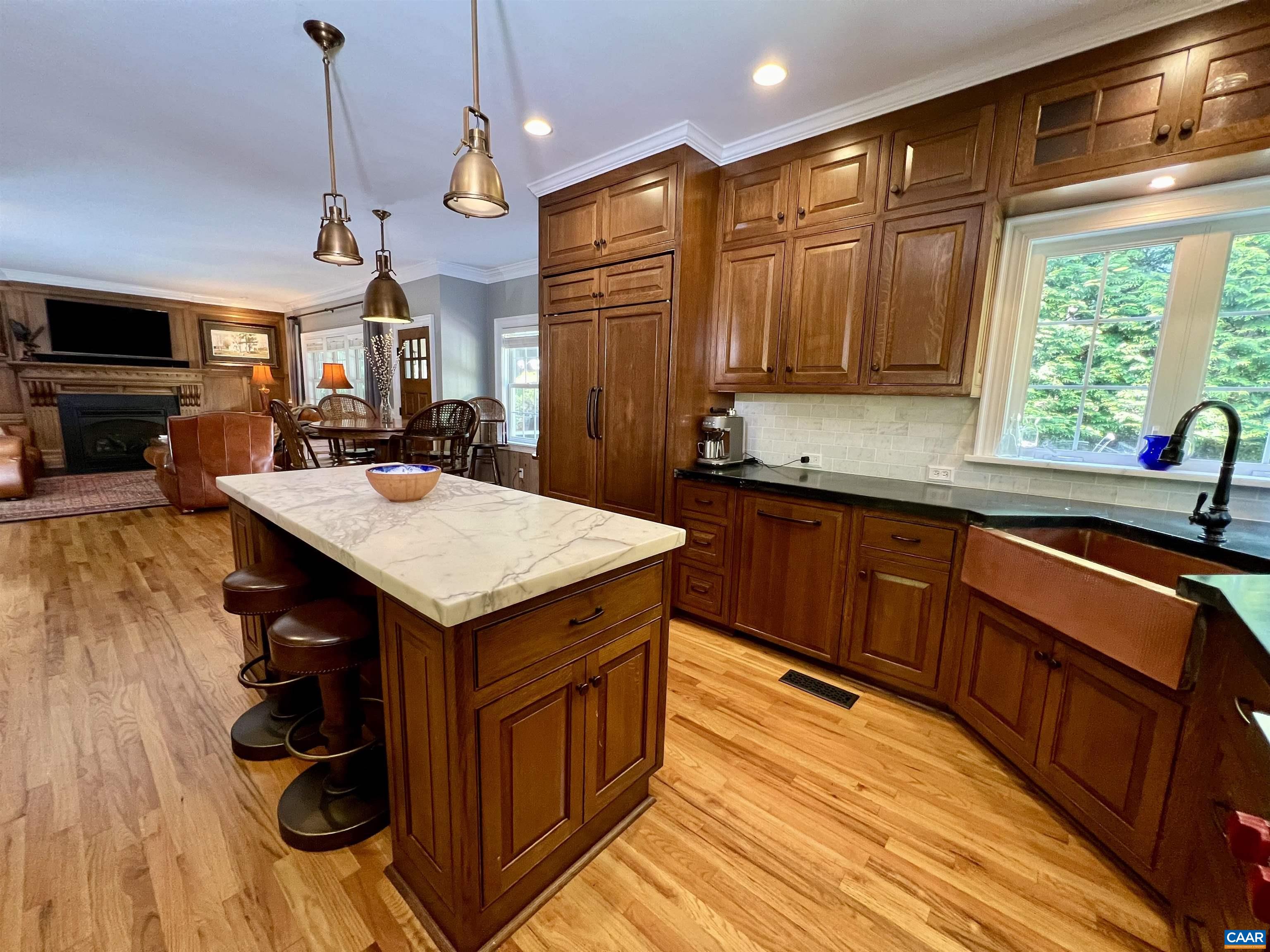 1340 Mosby Rch Charlottesville, VA 22901 - Photo 19 of 62 a kitchen with wooden cabinets and sink