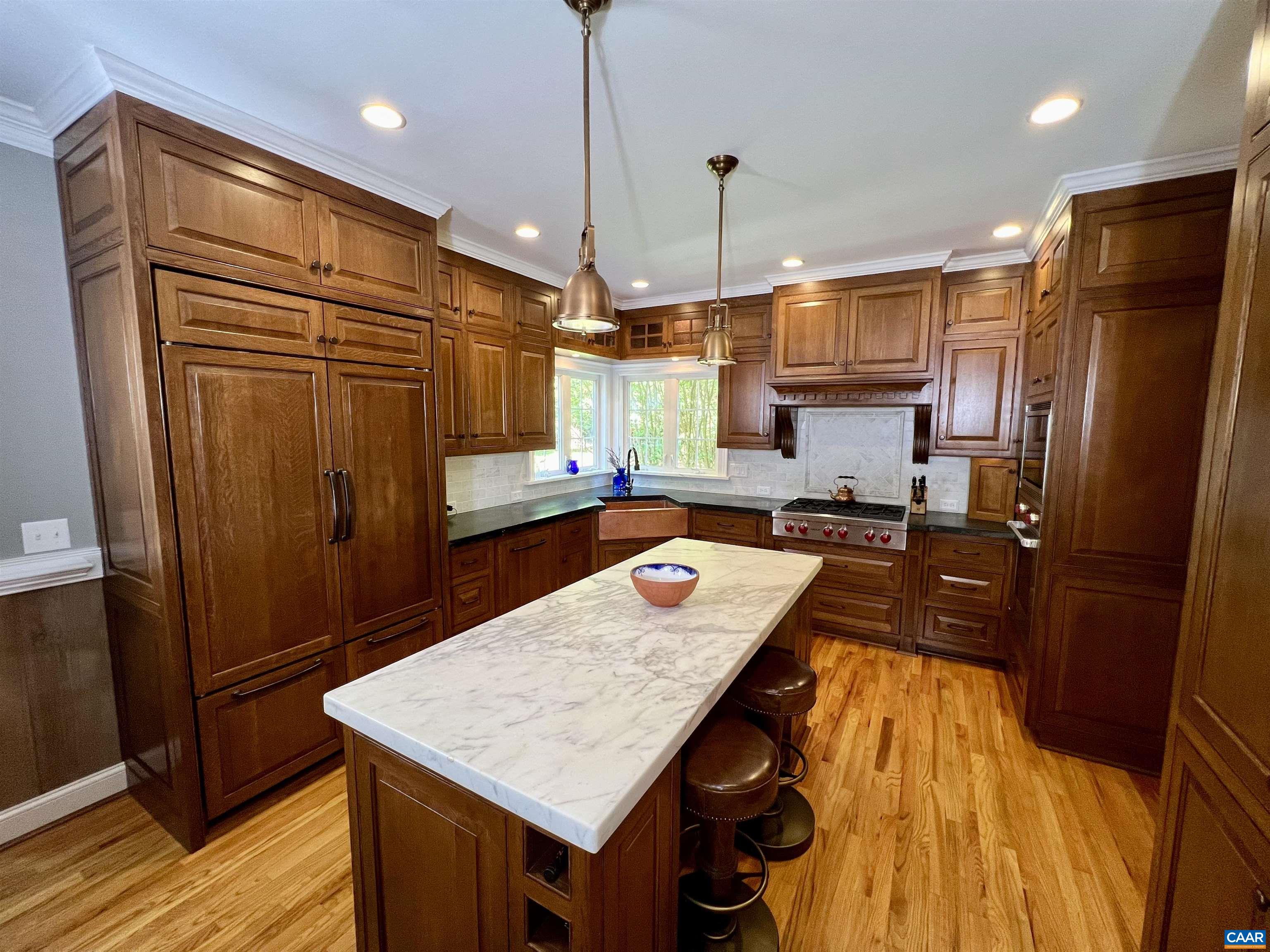 1340 Mosby Rch Charlottesville, VA 22901 - Photo 20 of 62 a kitchen with stainless steel appliances granite countertop a refrigerator a sink and wooden cabinets