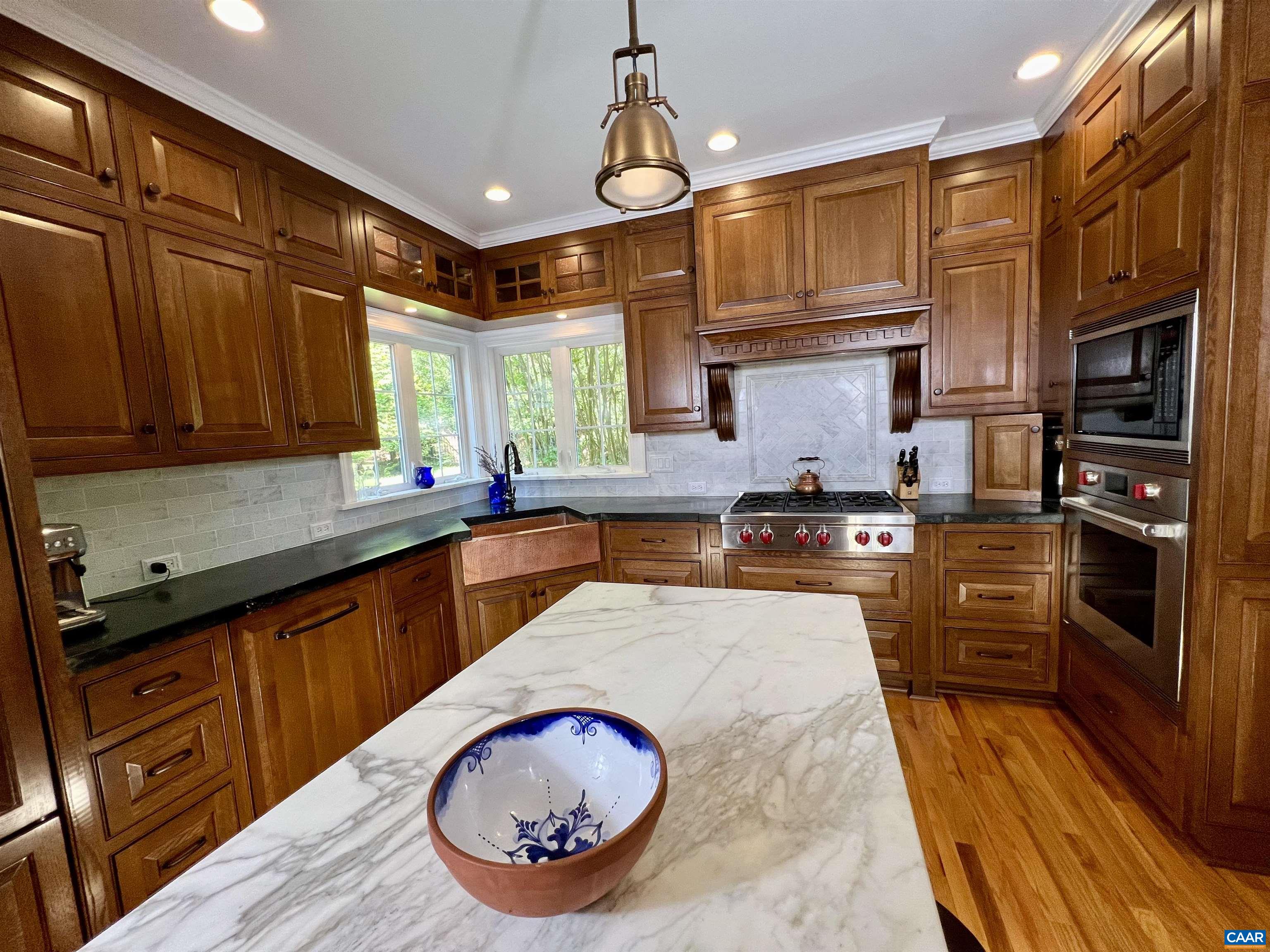 1340 Mosby Rch Charlottesville, VA 22901 - Photo 21 of 62 a kitchen with stainless steel appliances granite countertop a stove a sink and a microwave