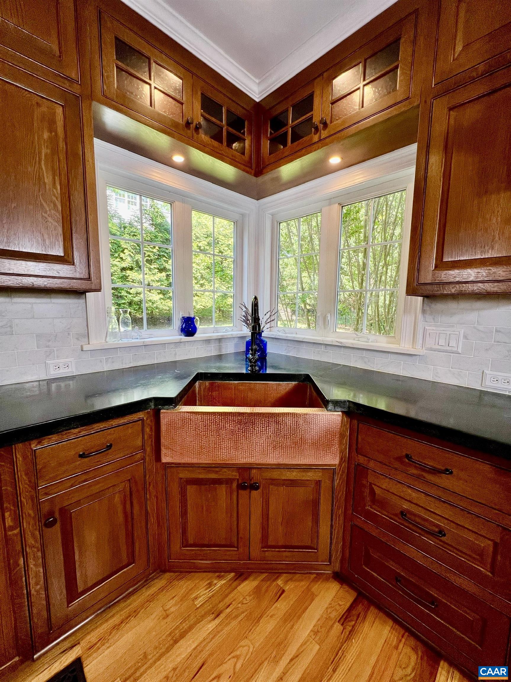 1340 Mosby Rch Charlottesville, VA 22901 - Photo 22 of 62 a kitchen with stainless steel appliances granite countertop a sink and wooden cabinets