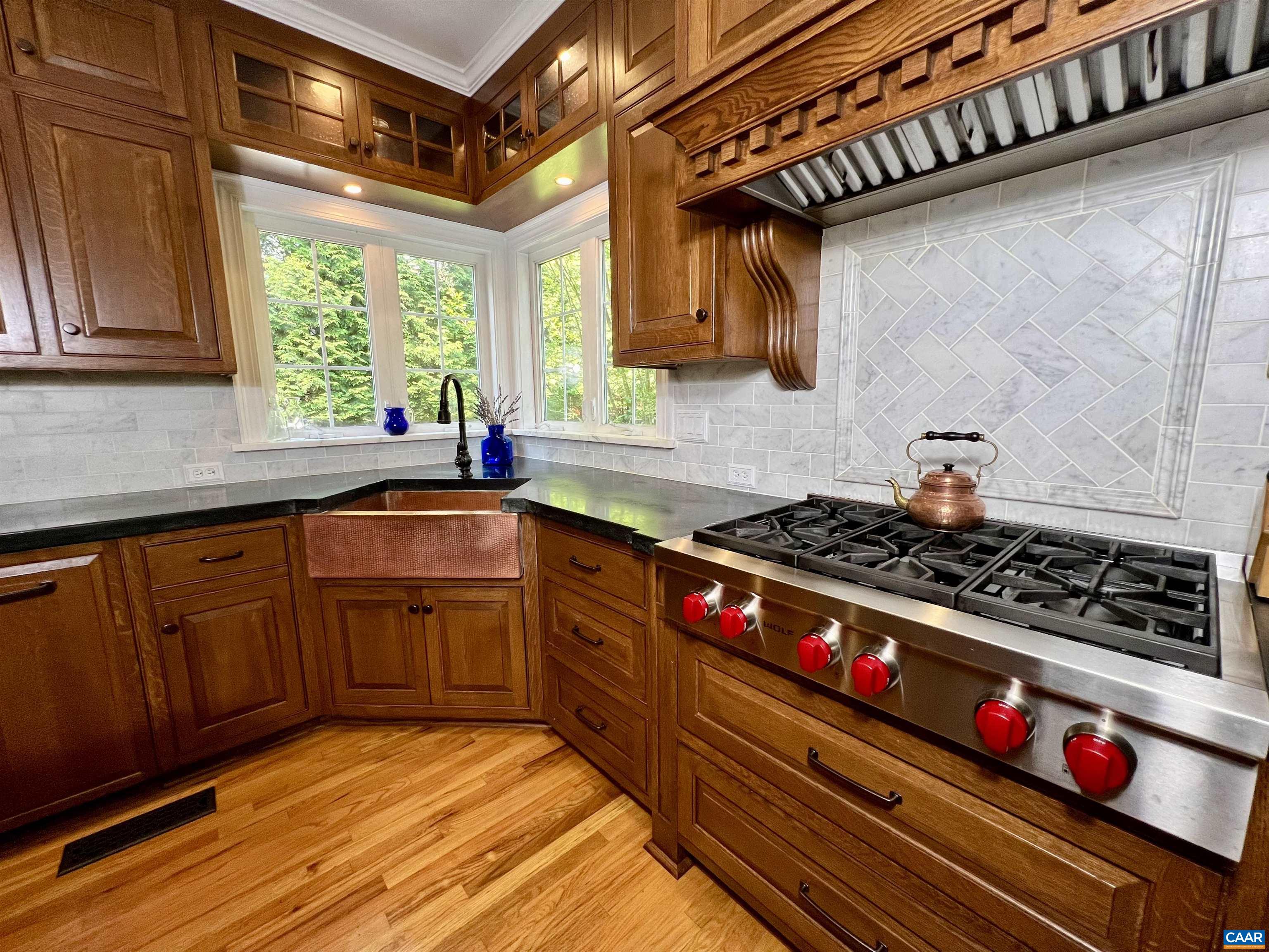 1340 Mosby Rch Charlottesville, VA 22901 - Photo 24 of 62 a kitchen with stainless steel appliances a stove a sink and a microwave