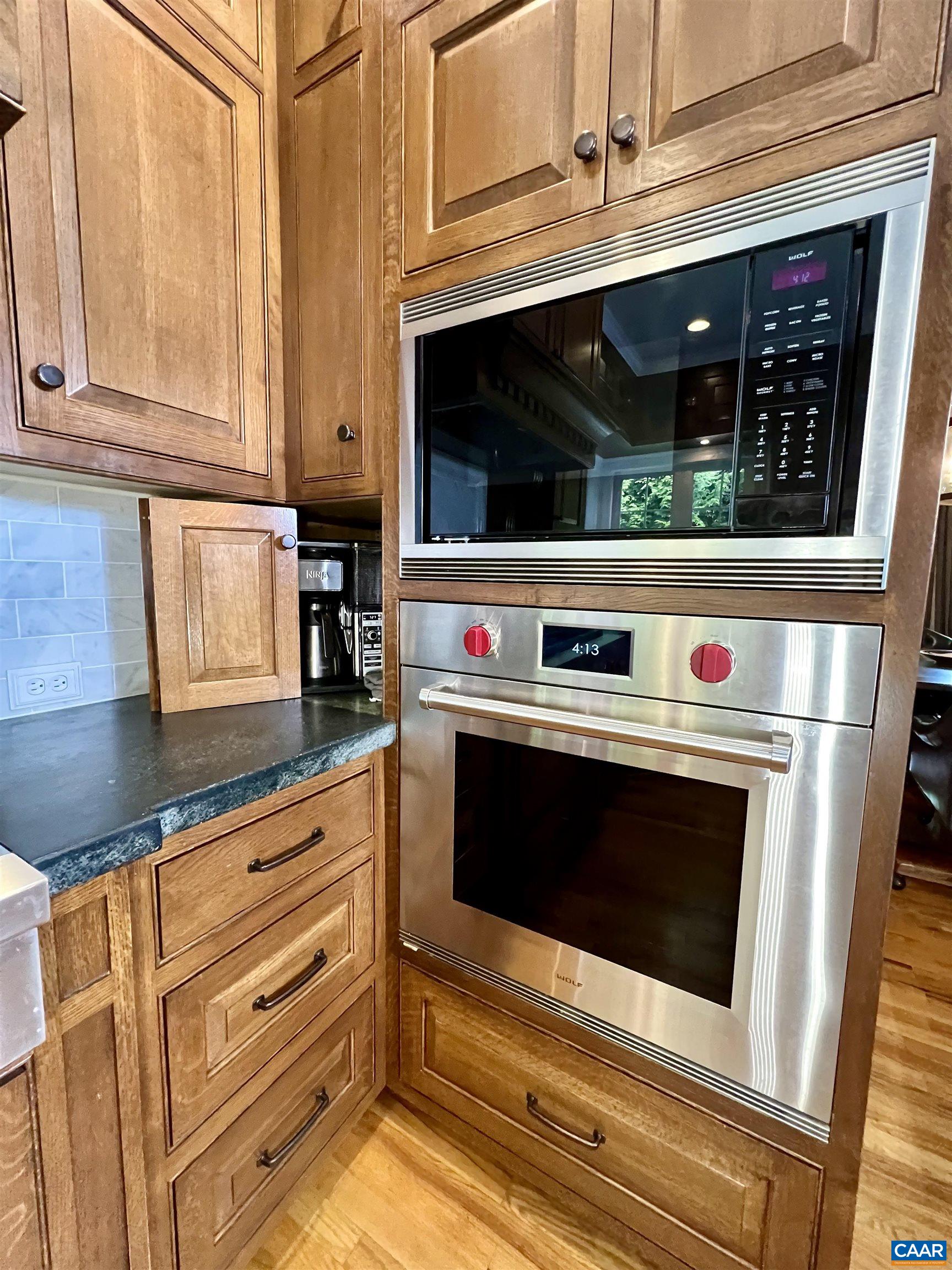 1340 Mosby Rch Charlottesville, VA 22901 - Photo 25 of 62 a kitchen with stainless steel appliances granite countertop a stove and a microwave
