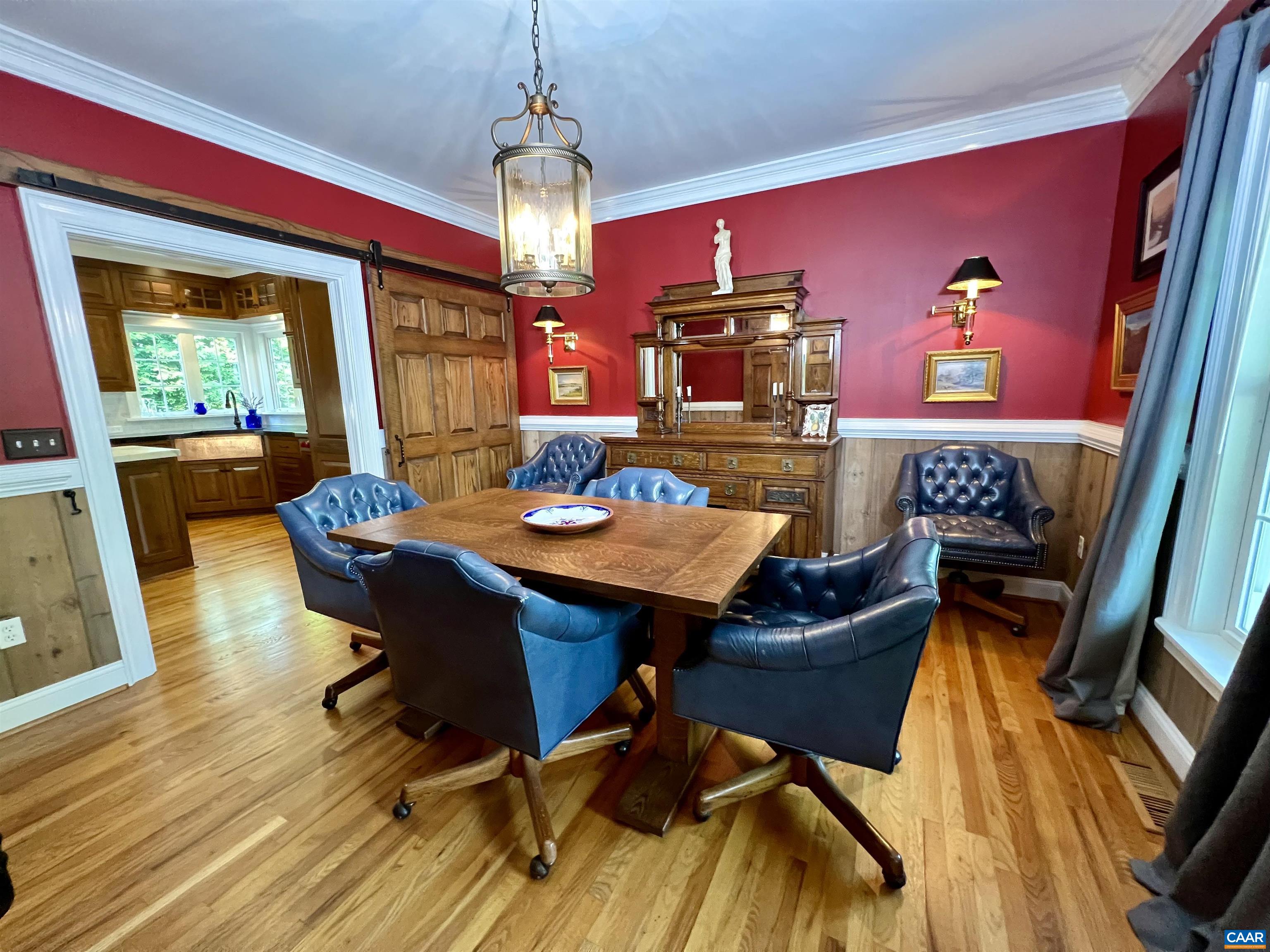1340 Mosby Rch Charlottesville, VA 22901 - Photo 28 of 62 a view of a dining room with furniture a chandelier and wooden floor