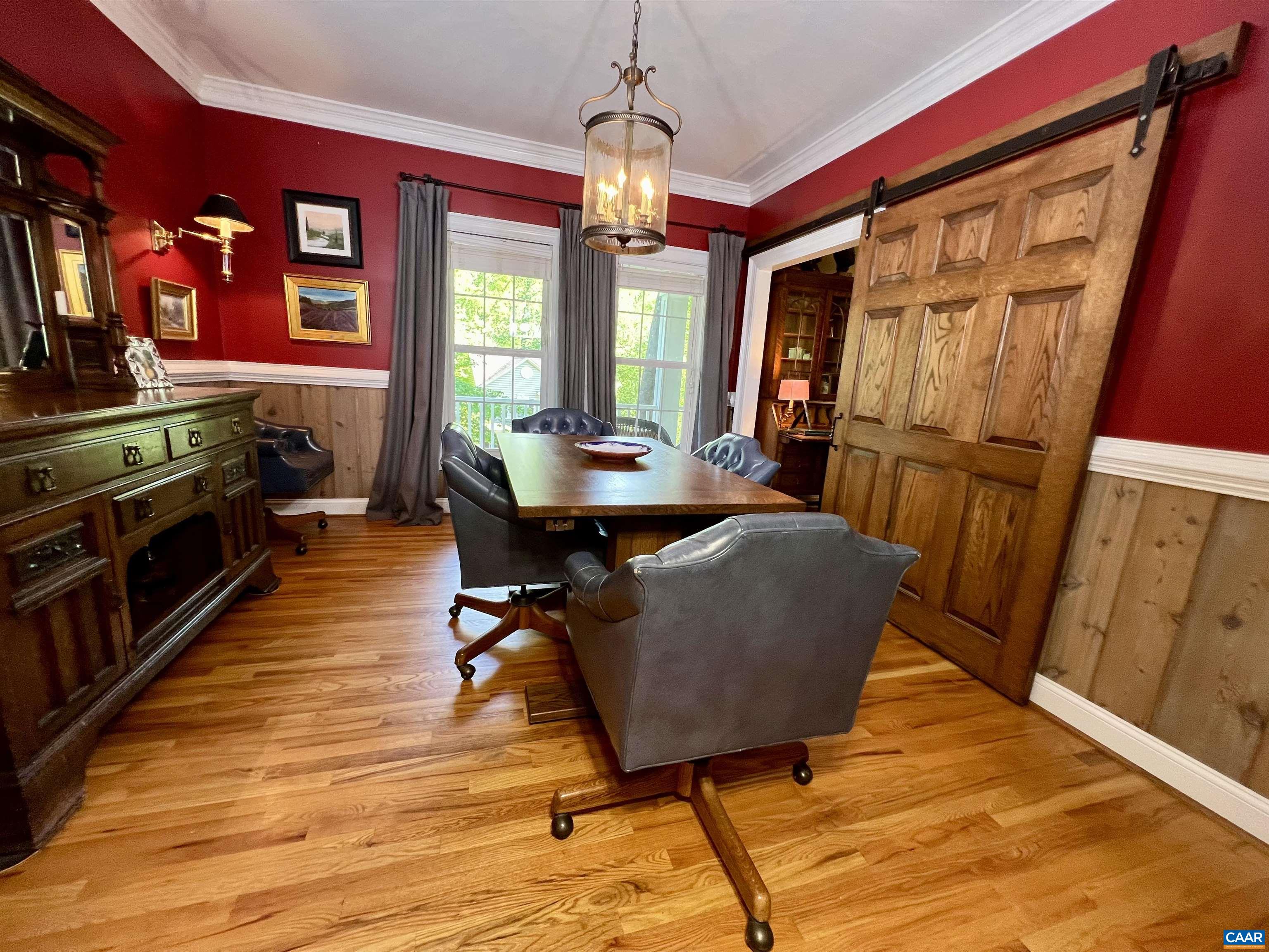 1340 Mosby Rch Charlottesville, VA 22901 - Photo 29 of 62 a dining room with wooden floor and furniture