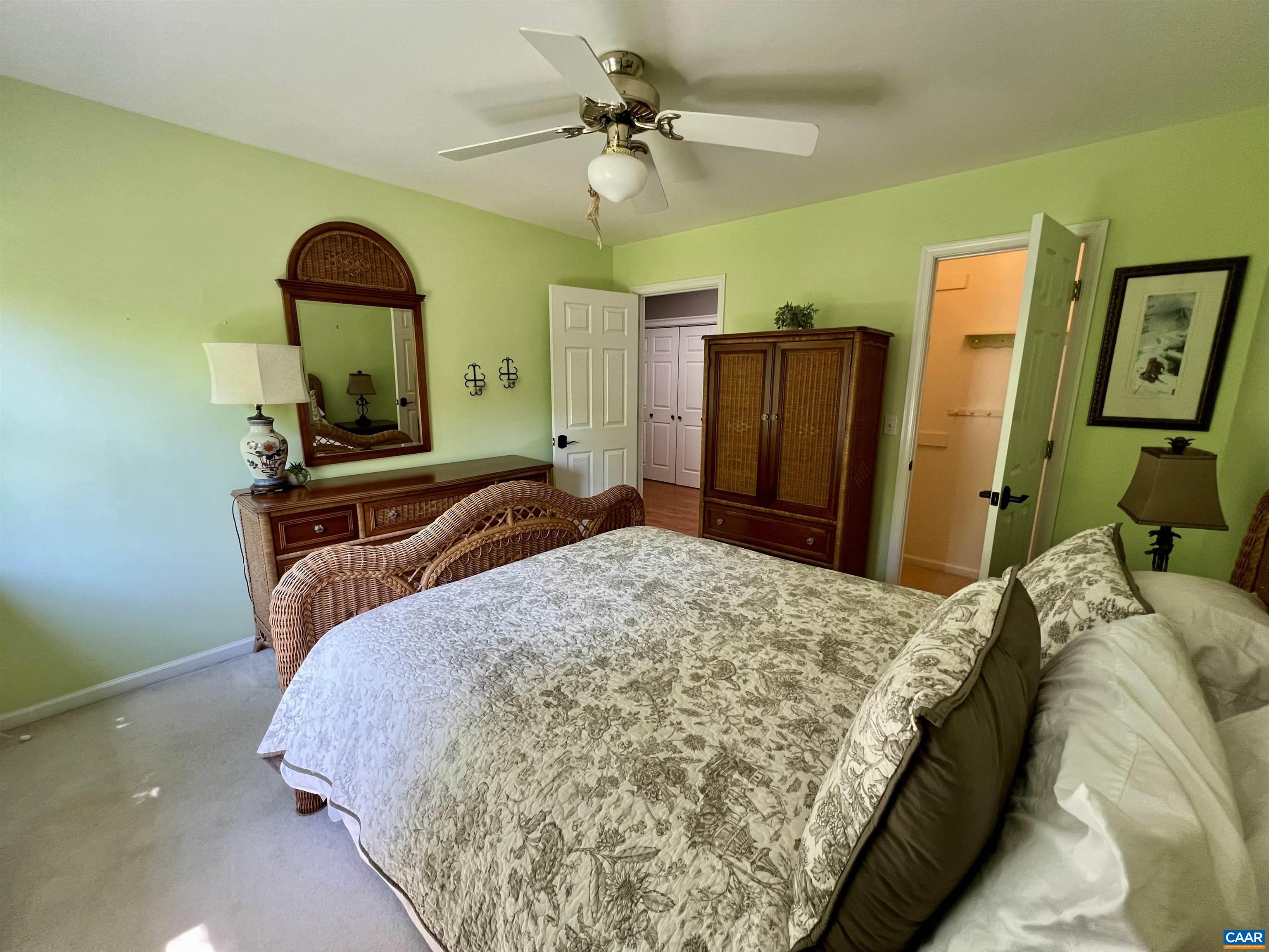 1340 Mosby Rch Charlottesville, VA 22901 - Photo 43 of 62 a bedroom with a bed dresser and a chandelier