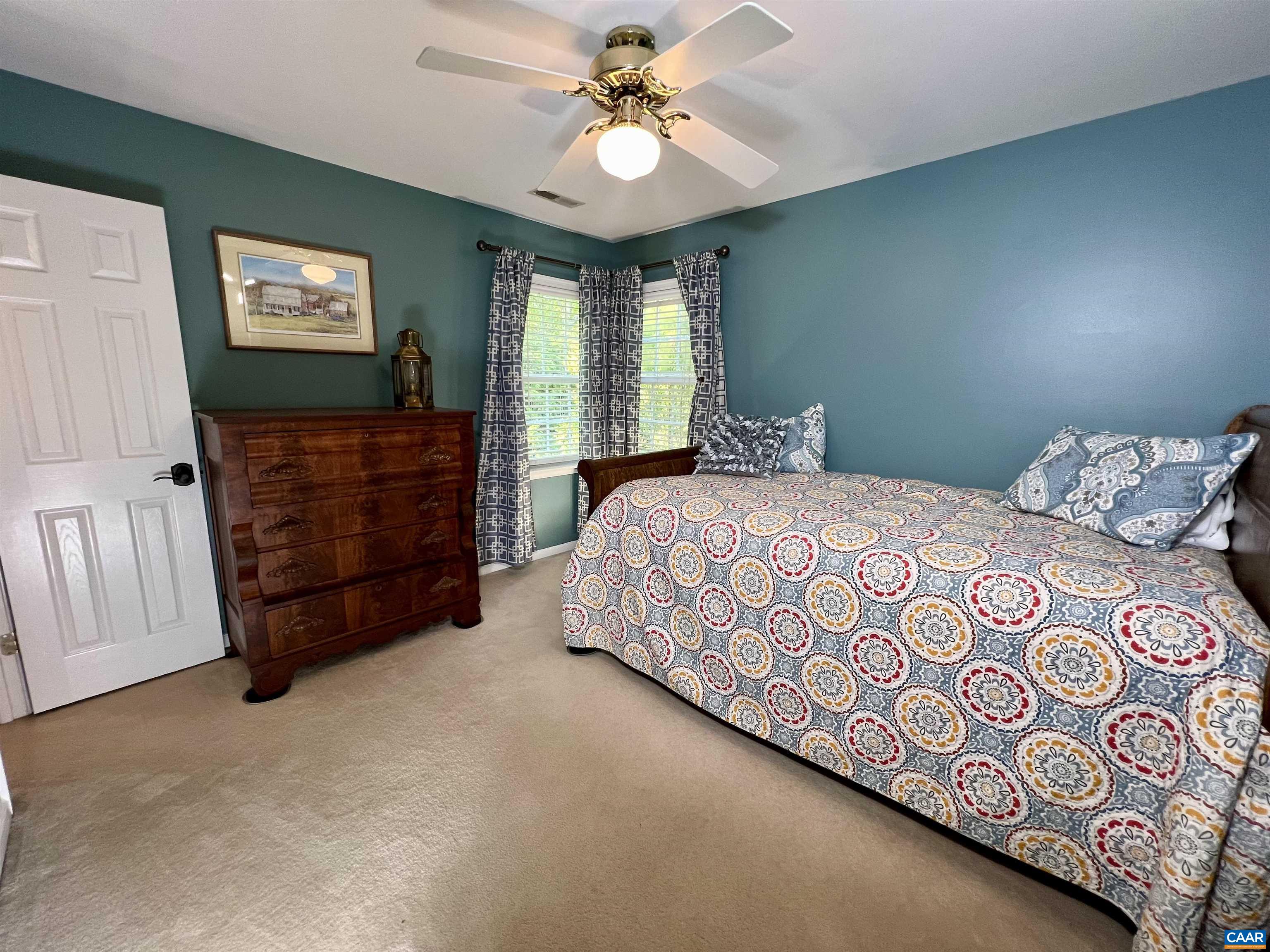 1340 Mosby Rch Charlottesville, VA 22901 - Photo 44 of 62 a bedroom with a bed and a chandelier