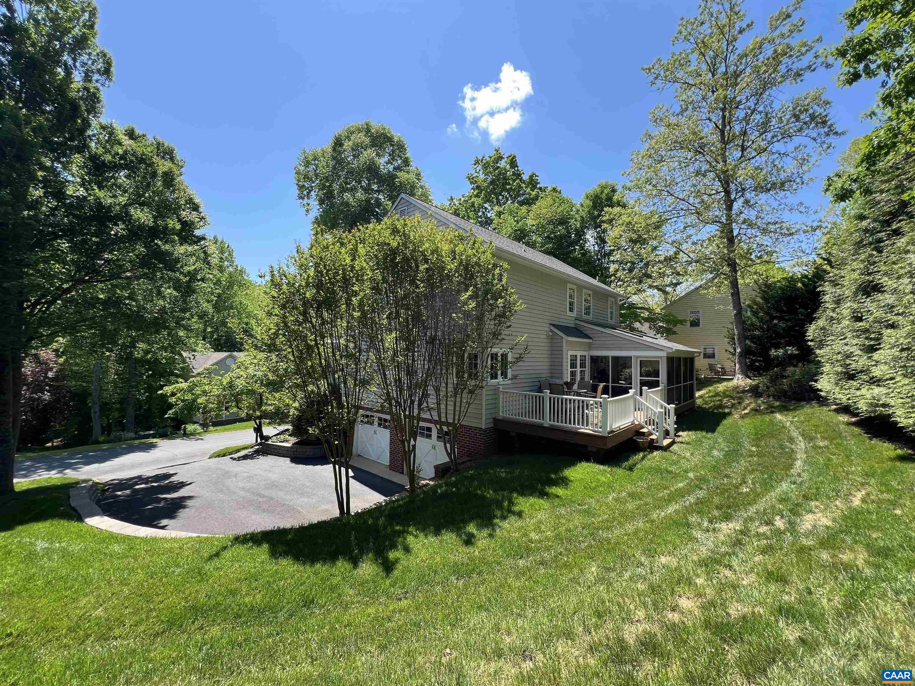 1340 Mosby Rch Charlottesville, VA 22901 - Photo 53 of 62 a view of a patio with table and chairs potted plants and large tree