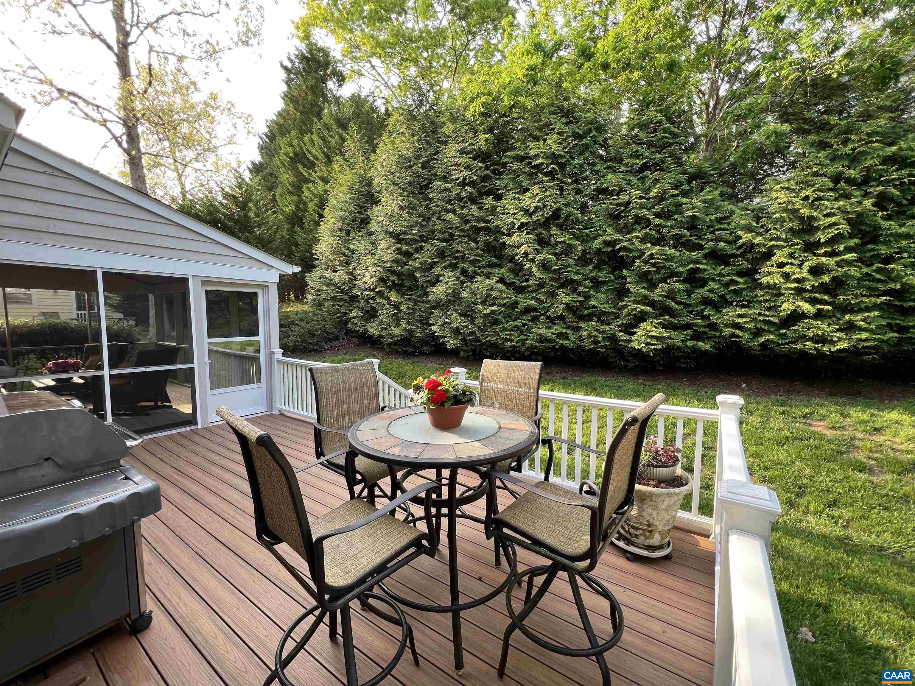 1340 Mosby Rch Charlottesville, VA 22901 - Photo 6 of 62 a view of a patio with table and chairs with wooden floor and fence