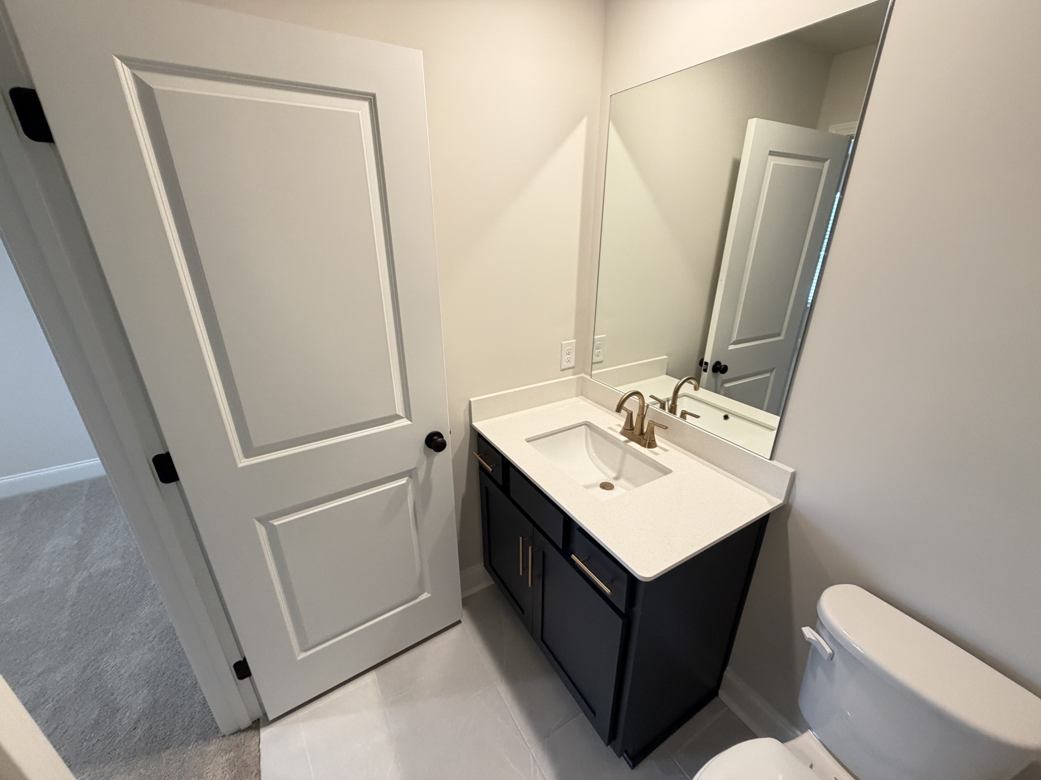 147 Emeline Way Mount Juliet, TN 37122 - Photo 31 of 41 a bathroom with a sink vanity granite toilet and a mirror