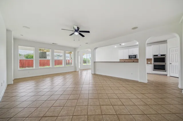a view of a kitchen with an empty space and a window