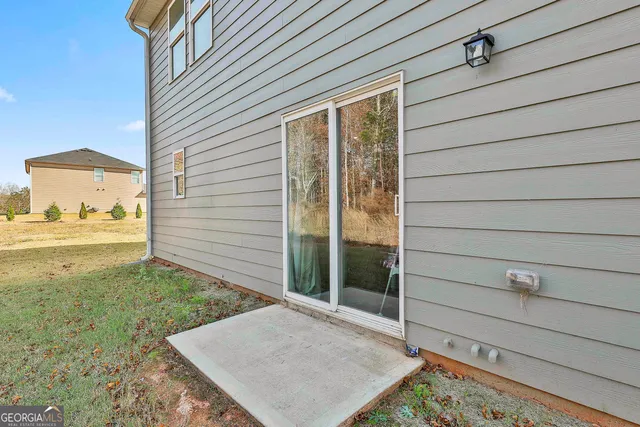 a view of a yard with large trees